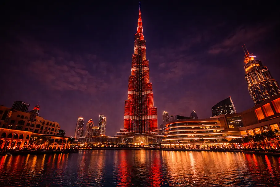 The Burj Khalifa and Dubai Fountain at night, representing premium transport services for theaters, concert venues, and event spaces.